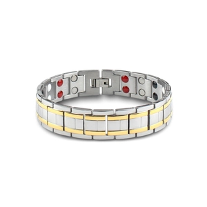 Macro view of two-tone magnetic therapy bracelet showing STAINLESS STEEL engraving