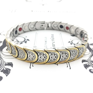 Two-tone silver and gold stainless steel magnetic therapy bracelet for men on display card