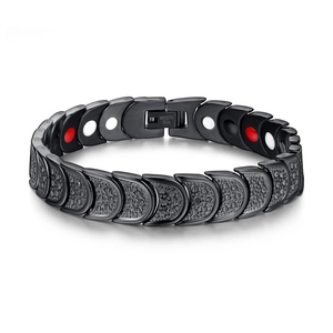 Detail view of black magnetic stainless steel bracelet with hammer-textured link finish