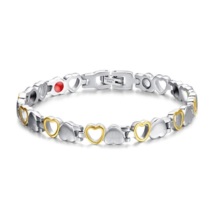 Close-up of stainless steel heart magnetic bracelet with gold and silver links