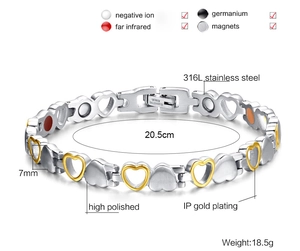 Detail view of heart-link magnetic therapy bracelet with gold and silver 316L steel