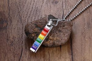 Macro shot of stainless steel rainbow rectangular pendant with colorful enamel on ball chain