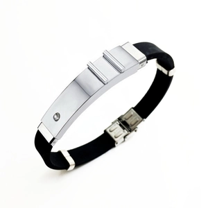 Detailed shot of black silicone band with silver stainless steel plate and small crystal