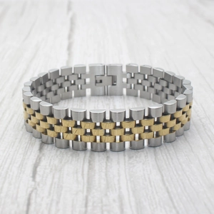 Detail of two-tone gold and silver Jubilee style stainless steel chain bracelet