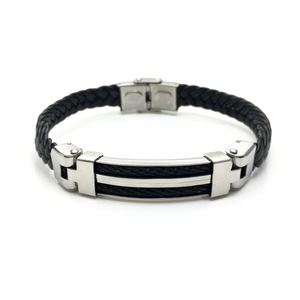 Detail of men's leather bracelet with silver stainless steel plate and black cable inlay