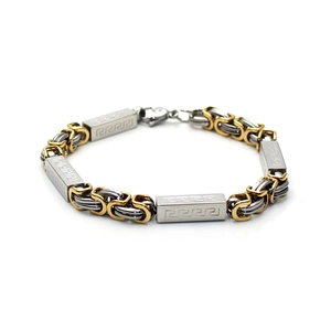 Macro detail of men's two-tone Byzantine chain bracelet with Greek Meander patterns