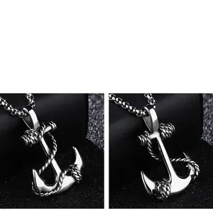 Detailed close-up of a silver anchor pendant with intricate rope texture and polished finish