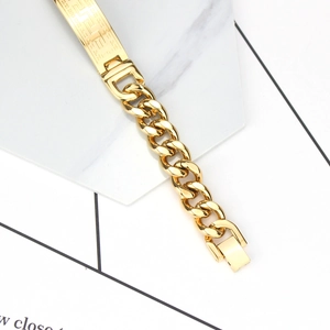 Bracciale da uomo a catena cubana dorata con motivo a greca su placchetta rettangolare