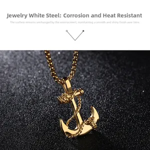 Detailed view of a gold anchor pendant in stainless steel with a beaded chain necklace
