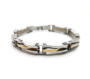 Detail of silver and gold men's steel link bracelet with rivet joints and diamond texture