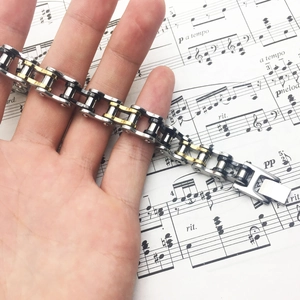Men's stainless steel bicycle chain bracelet in silver, gold, and black tri-color finish