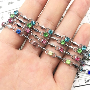 Multi-colored zircon bracelet with silver chain and angular geometric rhinestone links