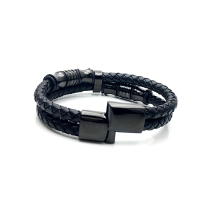 Double-layer black braided leather bracelet for men with secure magnetic clasp on white background