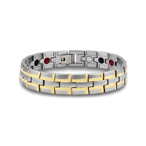 Close-up of magnetic stainless steel bracelet showing inner magnets and two-tone gold finish