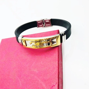 Punk style men's black silicone bracelet featuring a gold scorpion on a steel plate