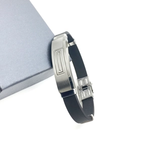 Men's stainless steel bracelet with black silicone strap and brushed geometric pattern