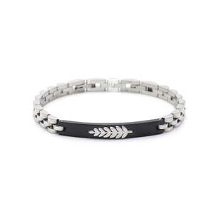 Detail of silver stainless steel men's bracelet with a black leaf motif centerpiece