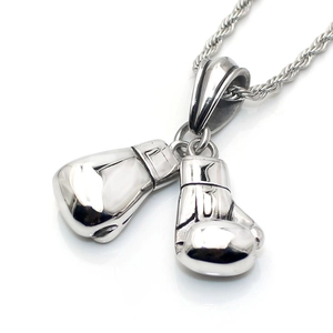 Macro shot of silver boxing glove pendants with detailed stitching on a rope chain