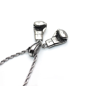 Punk style stainless steel boxing glove pendant necklace for men on white background