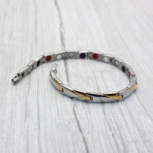 Magnetic therapy bracelet in two-tone silver and gold stainless steel with folding clasp