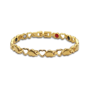 Detailed macro view of gold-plated heart-shaped magnetic therapy bracelet for women