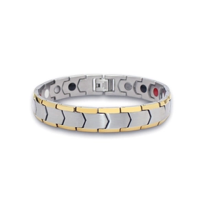 Detailed macro view of gold and silver herringbone magnetic health bracelet for men