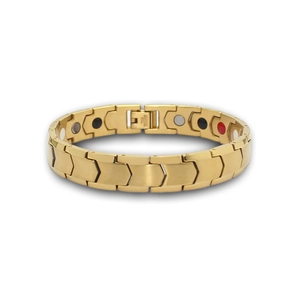 Macro detail of golden herringbone link bracelet showing inner magnetic therapy energy stones