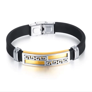 Detail of stainless steel clasp with Greek meander pattern and matte silicone strap