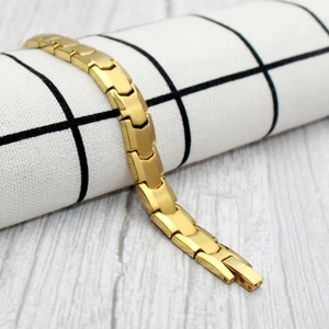 Bracelet magnétique doré poli avec motif à chevrons et fermoir déployant de sécurité