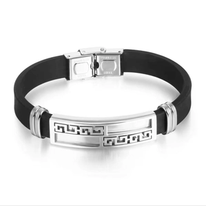 Detailed close-up of meander pattern on stainless steel and black silicone bracelet