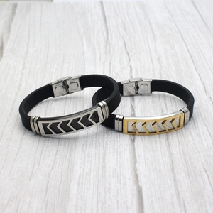 Detail of men's silicone bracelets with stainless steel buckle and arrow design plate