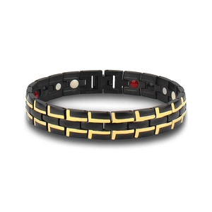 Detail view of magnetic energy therapy bracelet with black matte and gold inlay textures