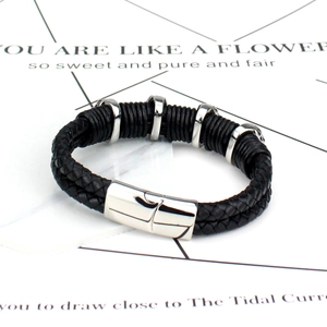 Men's double braided black leather bracelet with silver skull accents and magnetic clasp