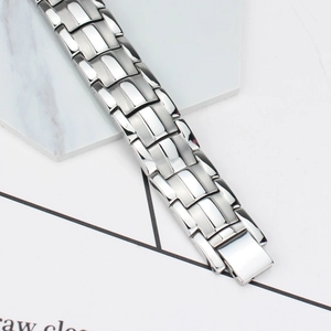 Detail of 15mm stainless steel bracelet with matte and polished links and folding clasp