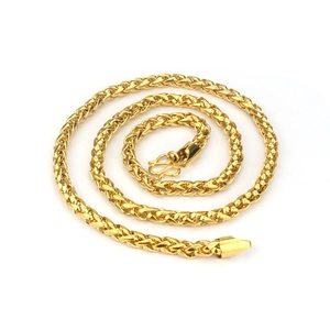 Macro view of 24K gold plated brass curb chain necklace with a textured M-shaped clasp