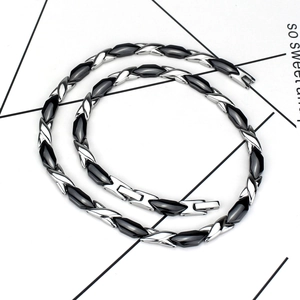 Polished silver stainless steel and black ceramic magnetic health necklace in double loop