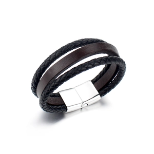 Detailed view of triple-layer braided leather bracelet with silver magnetic metal clasp