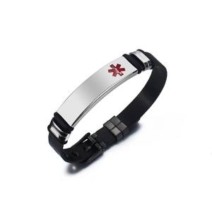 Close-up of black mesh medical alert bracelet with polished steel plate and red Caduceus