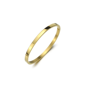 Macro shot of polished gold-plated flat bangle showing hinge detail and metallic gloss