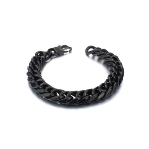 Macro detail of black chunky cuban link chain bracelet with lobster clasp for men