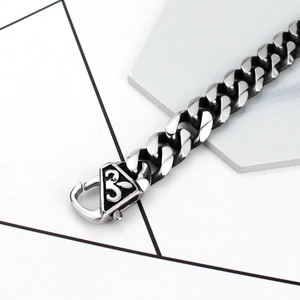 Classic silver and black stainless steel Cuban link bracelet for men with triangle clasp