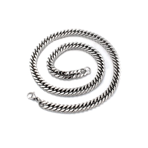 Detailed view of silver stainless steel curb chain featuring a sturdy lobster clasp