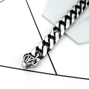 Close-up of vintage titanium steel chain with engraved decorative clasp detail