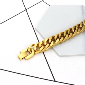 Polished gold titanium steel Cuban chain bracelet for men featuring heavy double link design