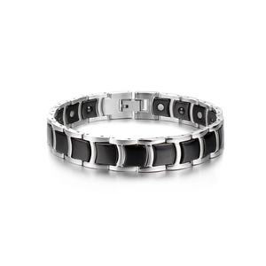 Close-up of men's magnetic health bracelet with black ceramic and stainless steel links