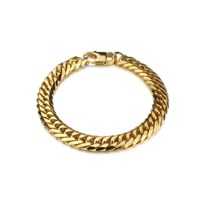 Close-up of golden Cuban link bracelet with lobster clasp on a clean white background