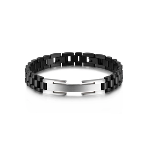 Detail of matte black watch-band style men's bracelet with brushed silver metal plate