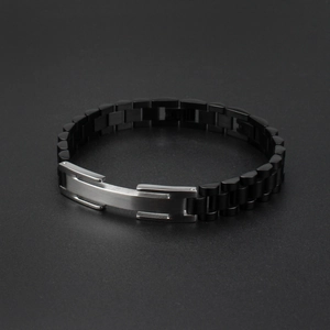 Detail of men's titanium steel watch-band bracelet with rectangular silver metal plate