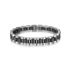 Close-up of industrial stainless steel magnetic bracelet with black ceramic links and magnets