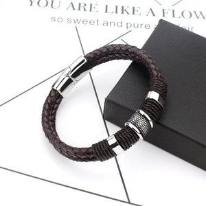Detail of men's brown braided leather bracelet with stainless steel magnetic clasp